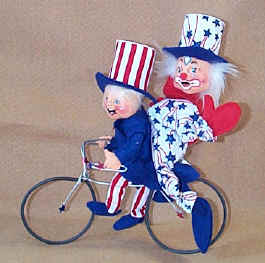 Photo of Sue Coffee Exclusives Patriotic boy riding on a bycicle with the Patriotic Clown on the back